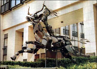 A woman riding a beast is displayed outside of the E.U. Parliament in Brussels!